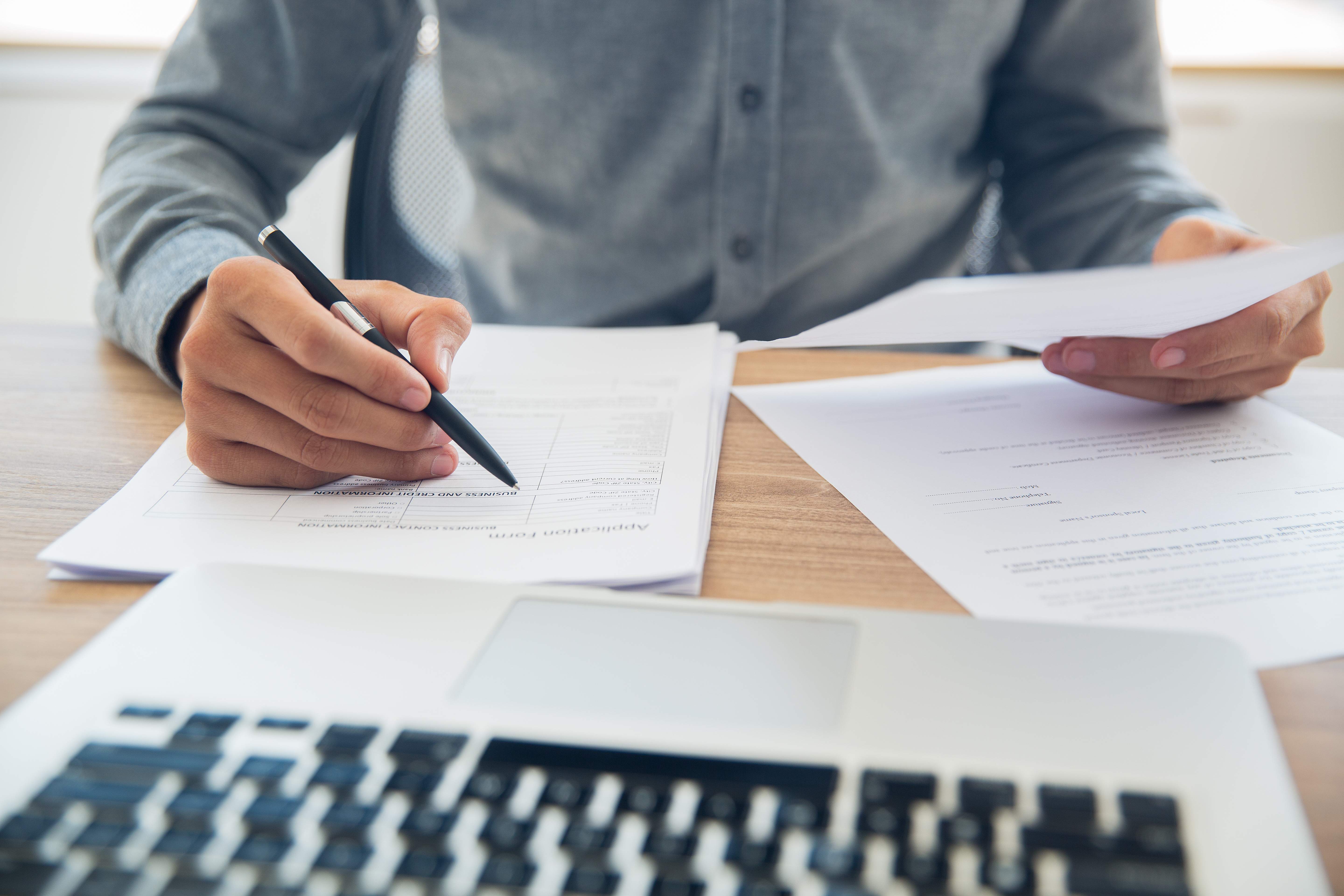 businessman checking documents table