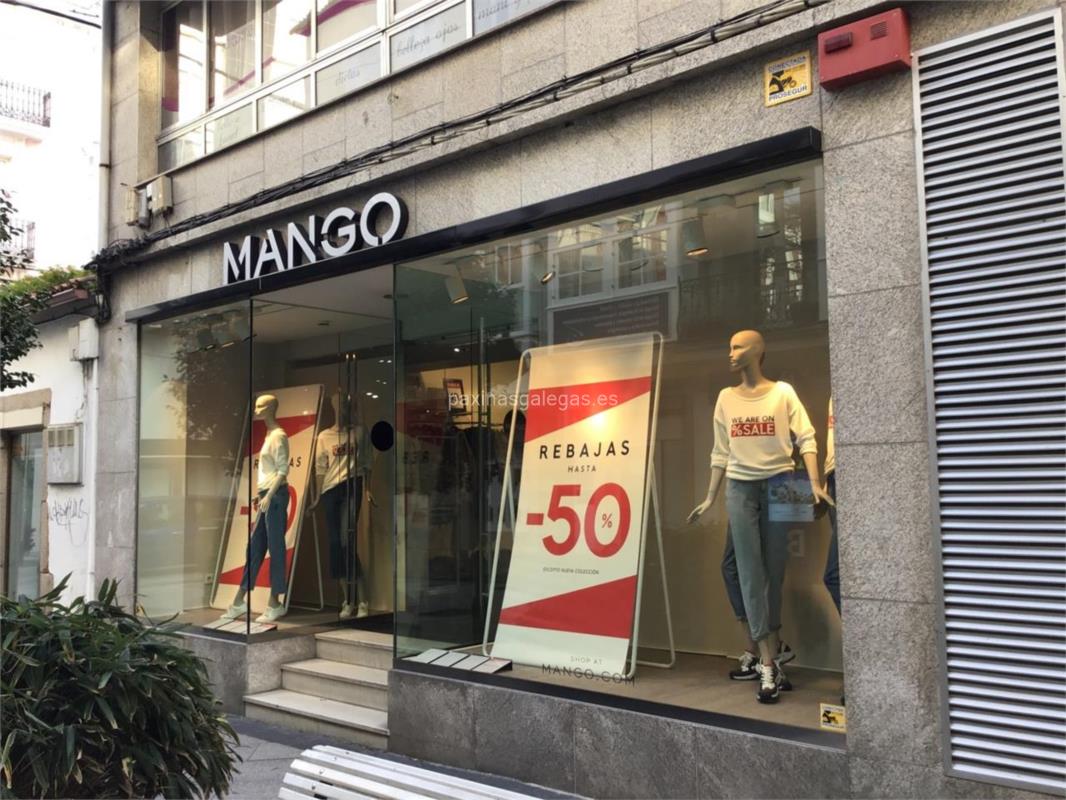 De vint-i-un botó amb el vestit camiser 100% lli de Mango