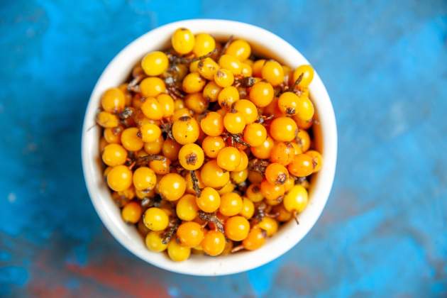 top view sigui buckthorn bowl blue surface