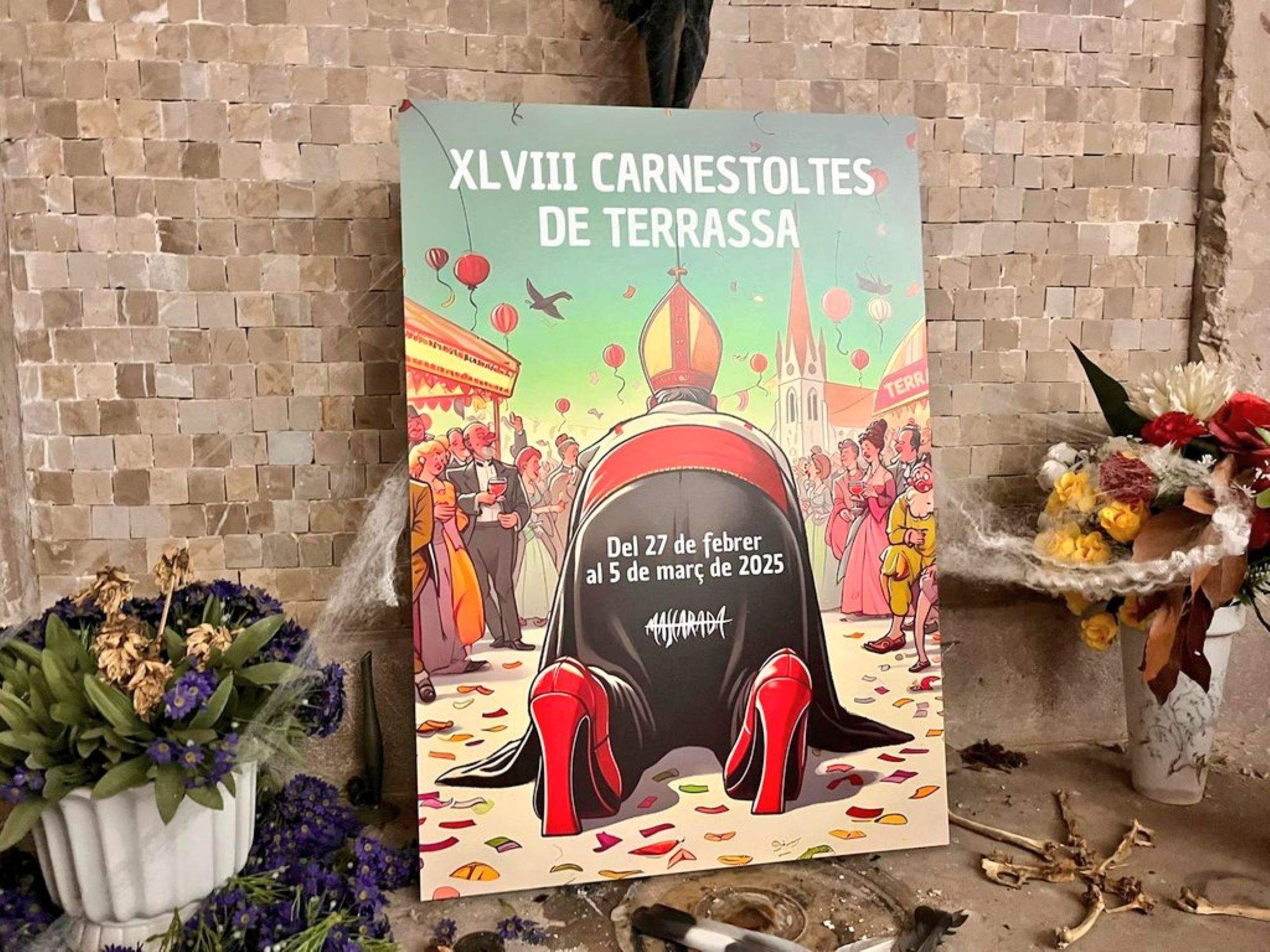 Polèmica pel cartell del Carnestoltes de Terrassa, que presenta un bisbe de quatre grapes