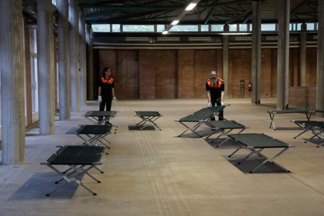 Protección Civil habilitó camas|lechos en el Palau Fires Girona / ACN Protección Civil habilitó camas|lechos en el Palau Fires Girona / ACN